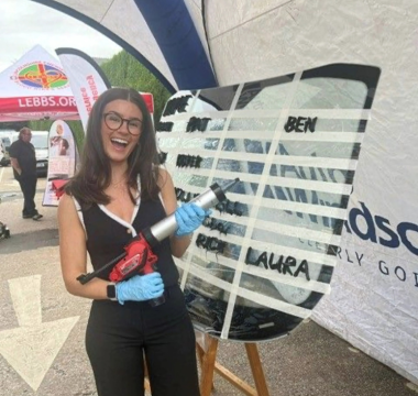 An Auto Windscreens partner taking part in a glue gun challenge